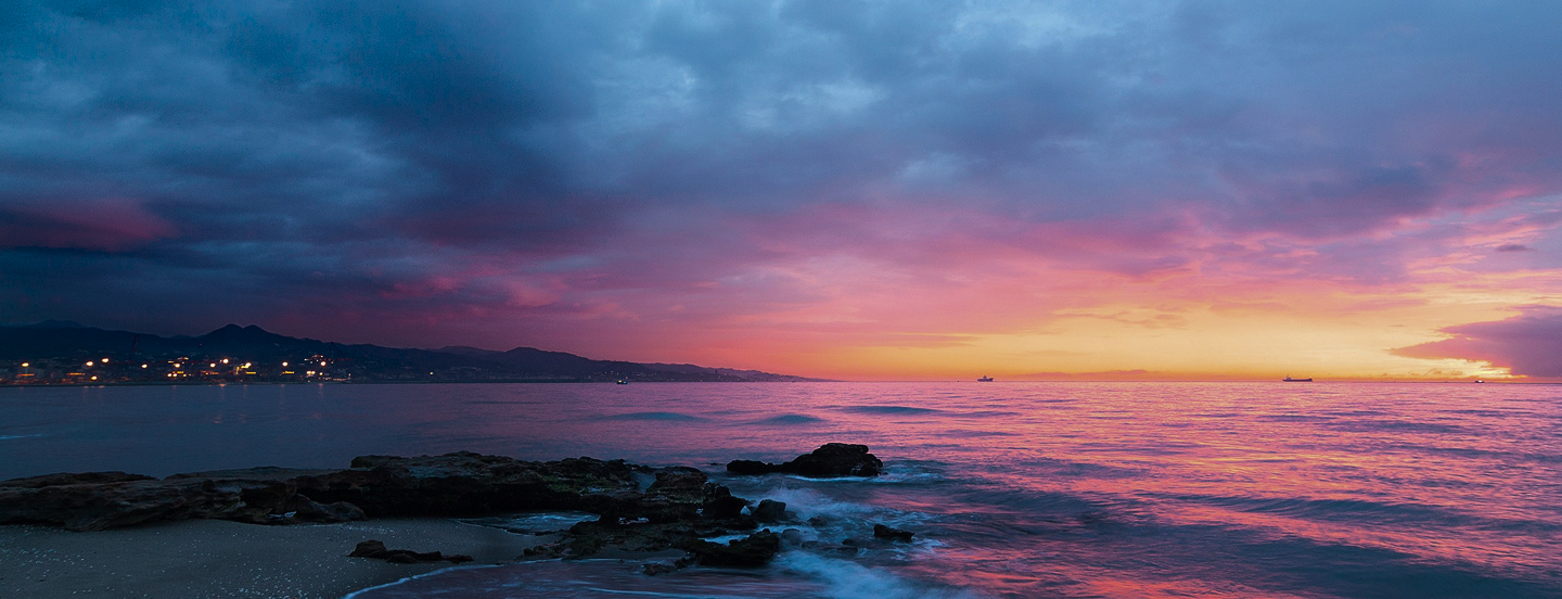 Sunset over coastal landscape